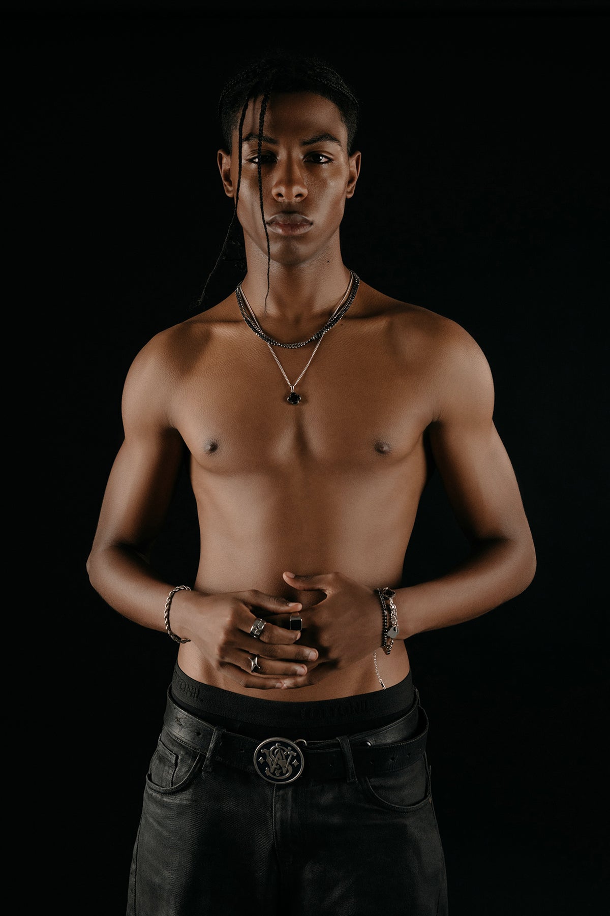 Model wearing Zorys chains, rings and bracelets